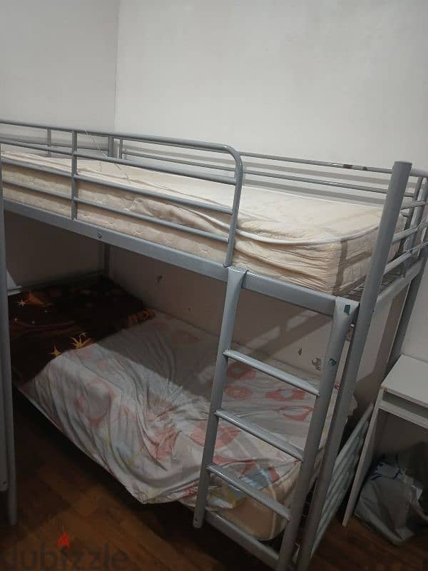 Iron bunk bed with mattresses in good condition 1