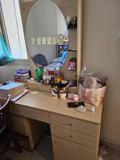 wardrobe with a dressing mirror and two side table