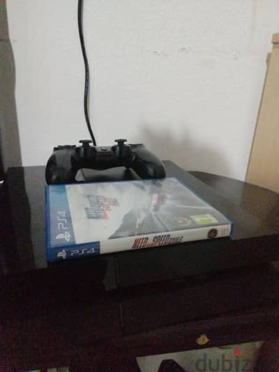 play station 4 for sale and 1 joystick and one game need for speed