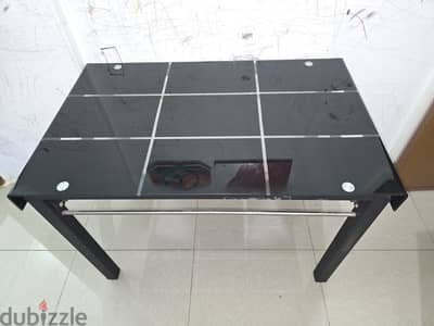 Dining table with glass top