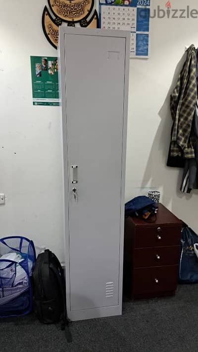 single bed and steel cupboard