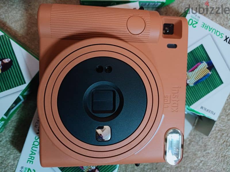 Fujifilm Instax SQ1 Camera, 140pc film sheet and album book. . 2