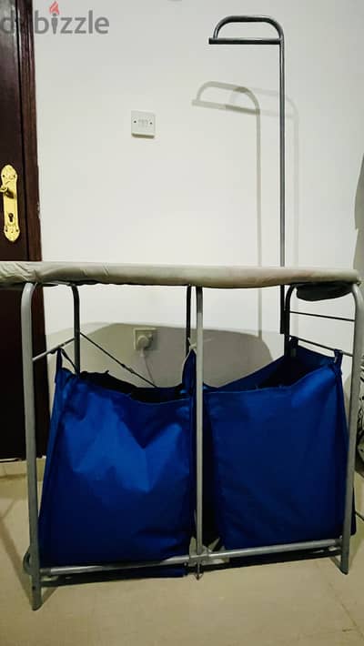 Used iron table with storage. Used Floor lamp from Homecentre