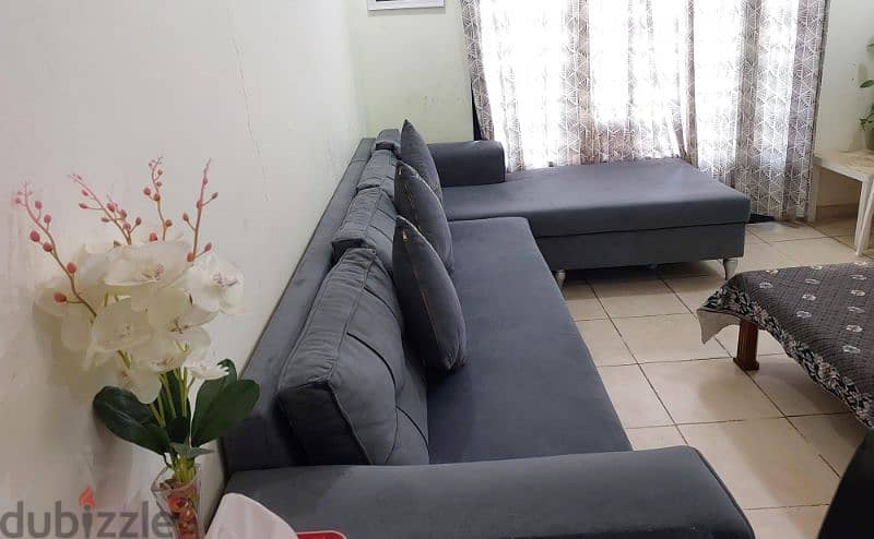 A big size sofa in grey colour in excellent condition 1