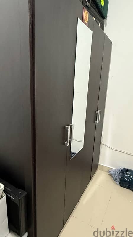 4 Door Wardrobe. Dark brown color bought from HomeCenter 5