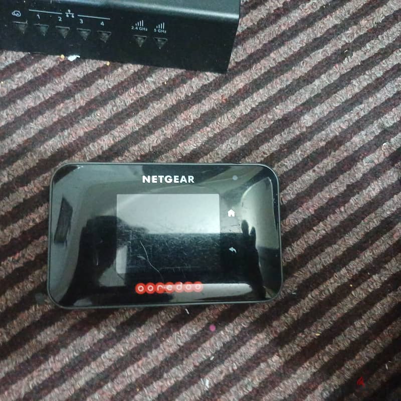 Netgear router unlocked , +Aircard smart Cradle 1