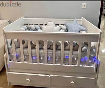 Baby crib with swing and storage