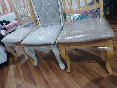 dining table and three big luxury chairs