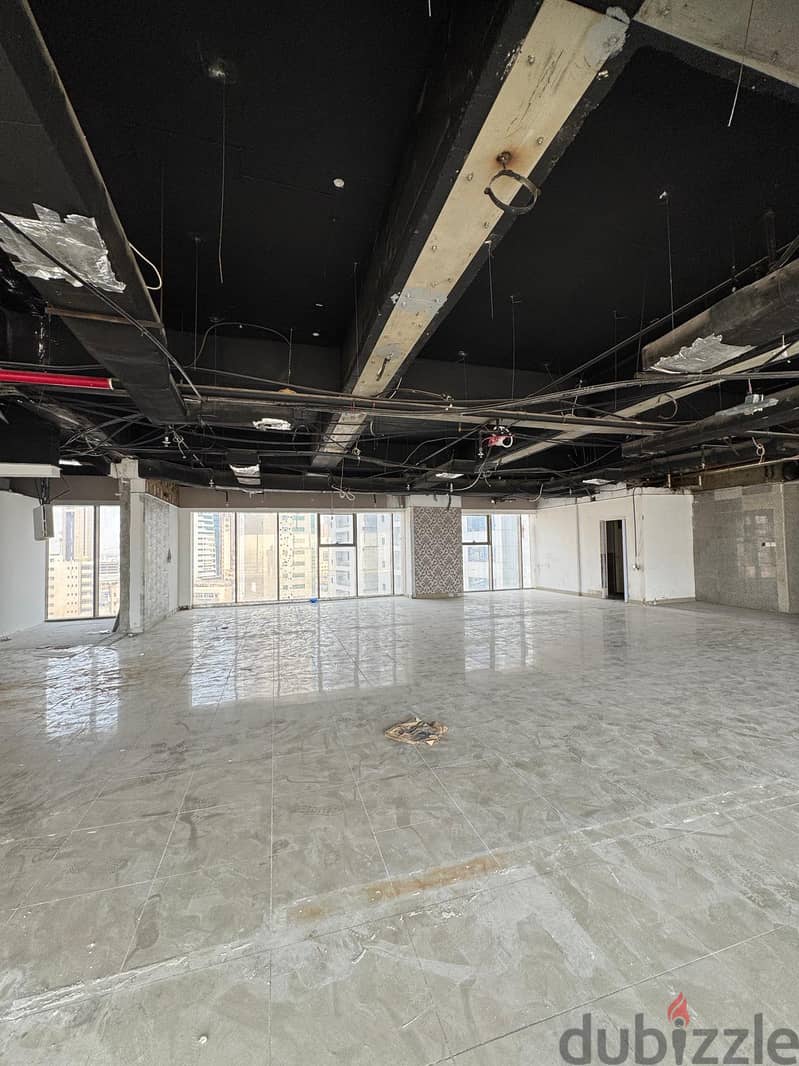 Half a commercial floor with a grace period for rent in Al Murqab 3