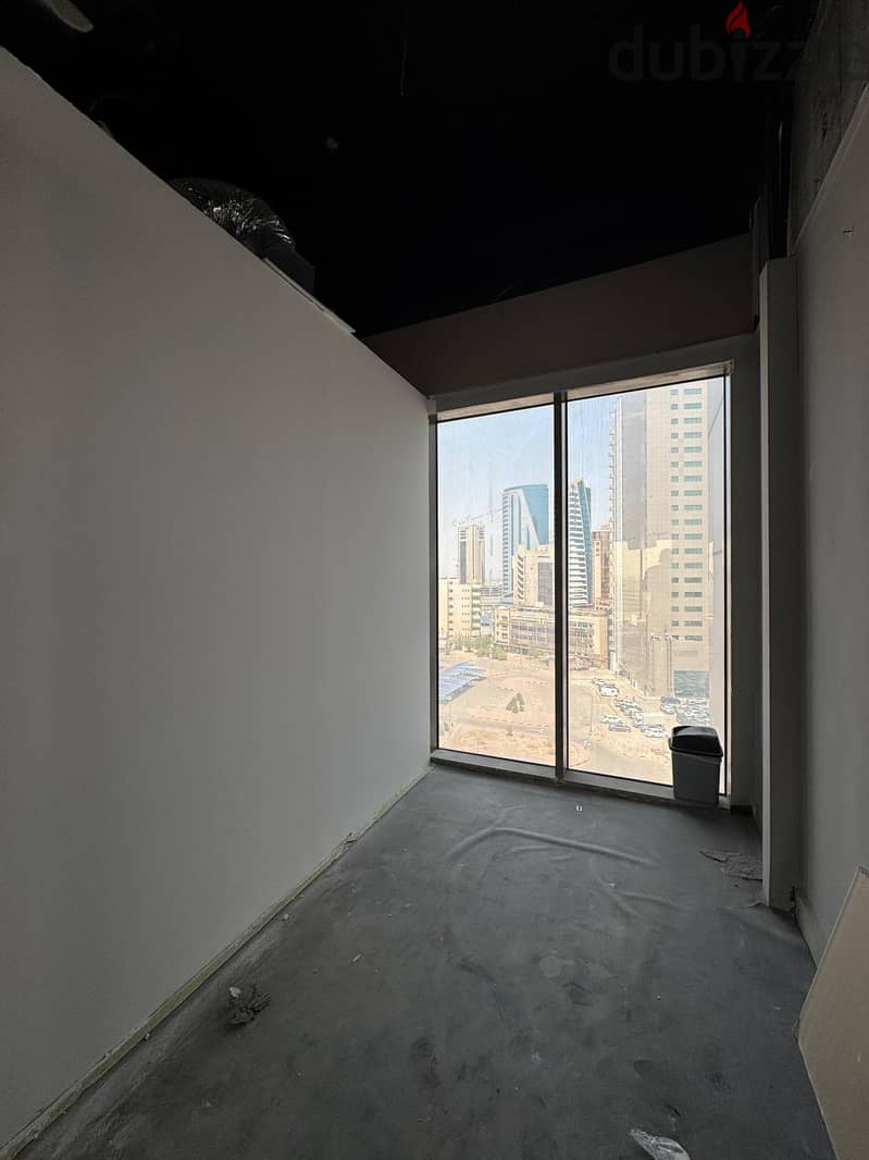 Half a commercial floor with a grace period for rent in Al Murqab 8