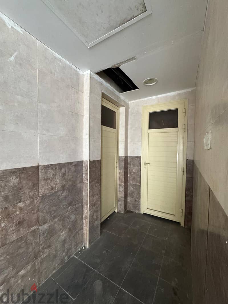 Half a commercial floor with a grace period for rent in Al Murqab 9