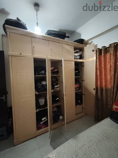 Cupboard three door cum top storage