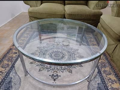 Round glass coffee table urgent sale.