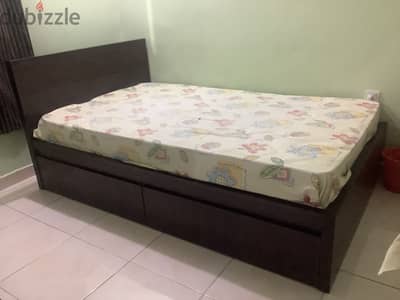 Bed with pull out storage draws