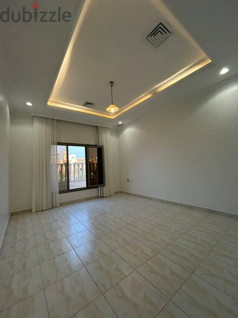 Full residential floor with a balcony for rent in Al-Adan 1