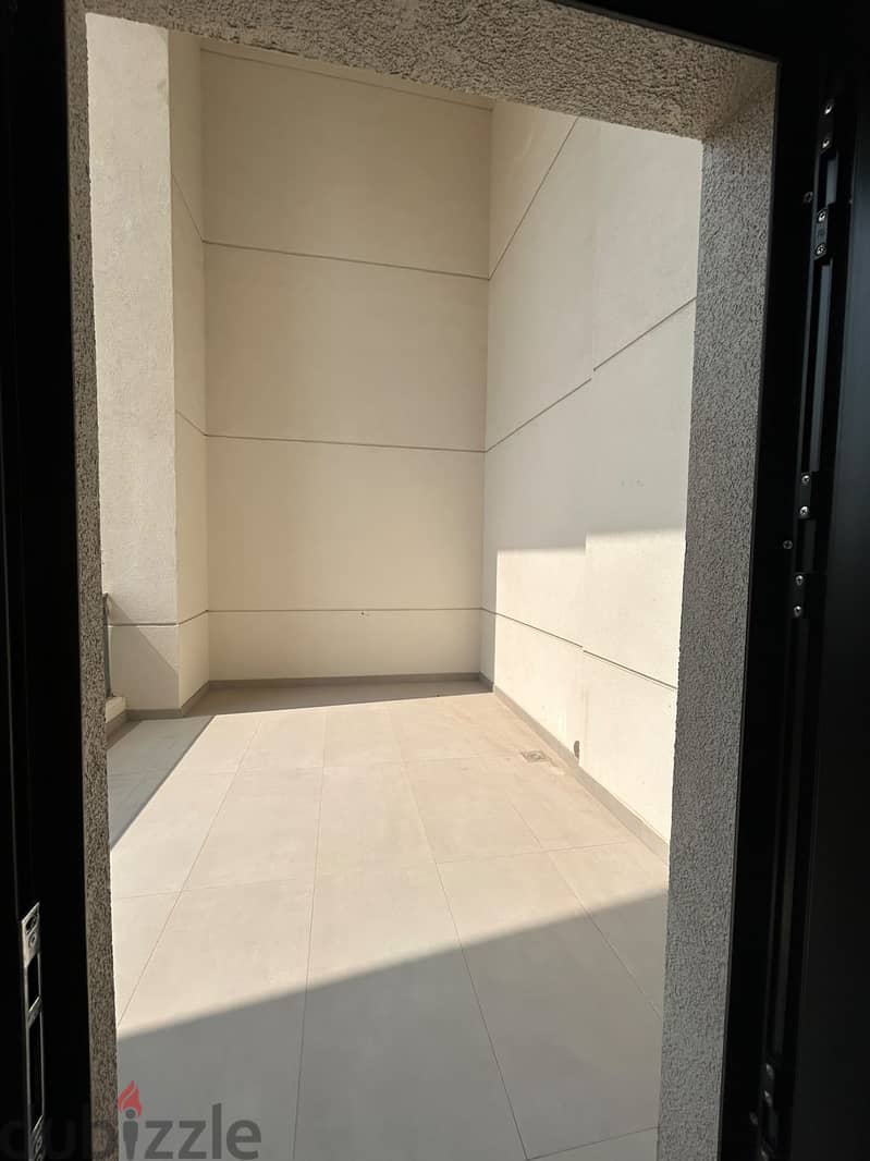 Semi-furnished apartment with a partial sea view for rent in Hessa Al- 3