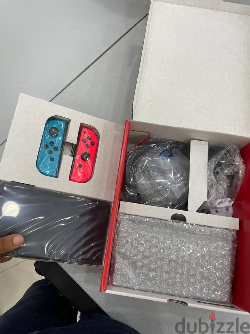 Brand new Nintendo Switch 32GB Red/Blue 1
