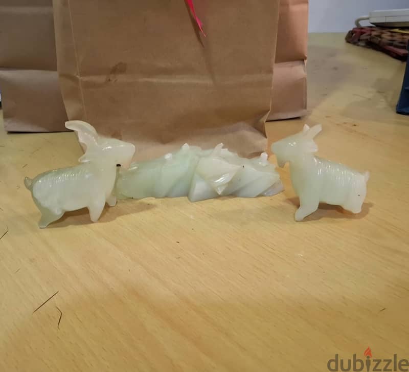 Hello, I have a jade stone sculpture featuring two beautifully carved 1