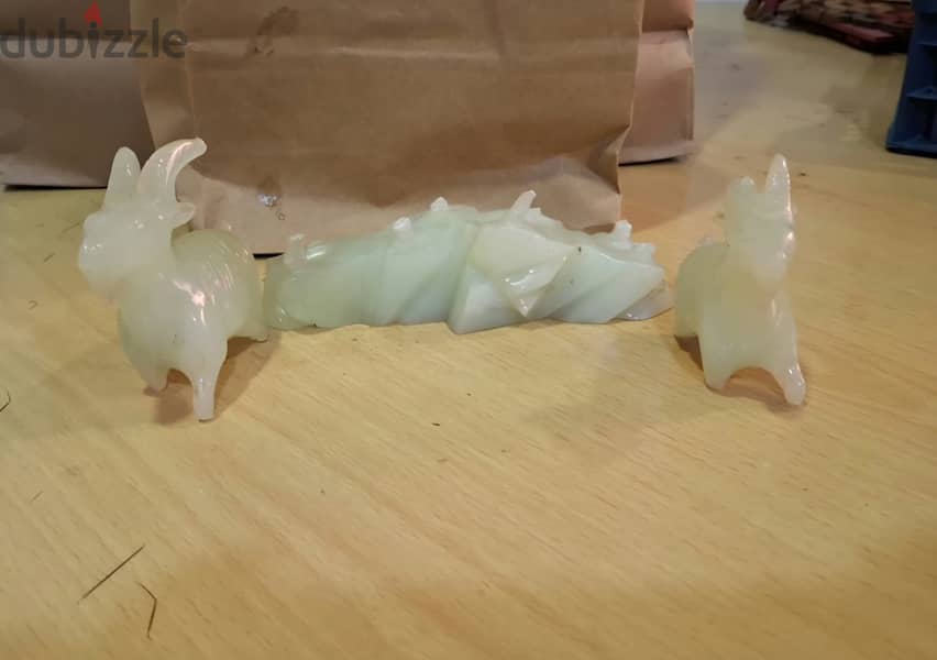 Hello, I have a jade stone sculpture featuring two beautifully carved 2