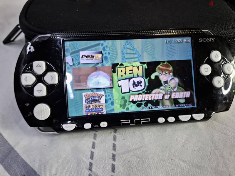 PSP P1000 BLACK 2GB 13 PSP GAME,15 NES,15 GAMEBOY 3