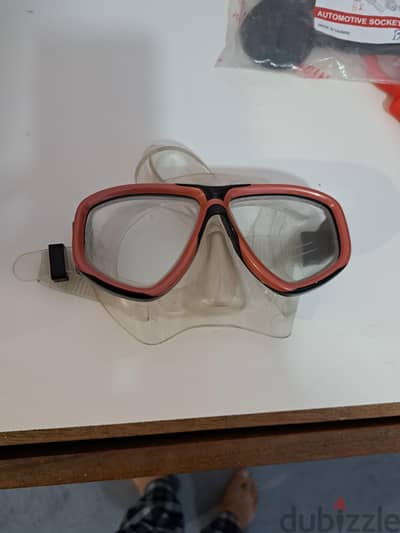 Coral Scuba Goggles with orange and black tempered glass dual lenses.
