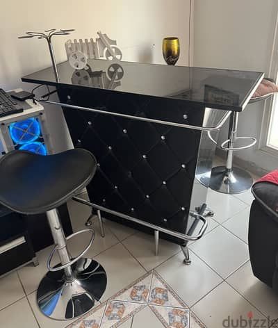 Bar table with high rise chairs