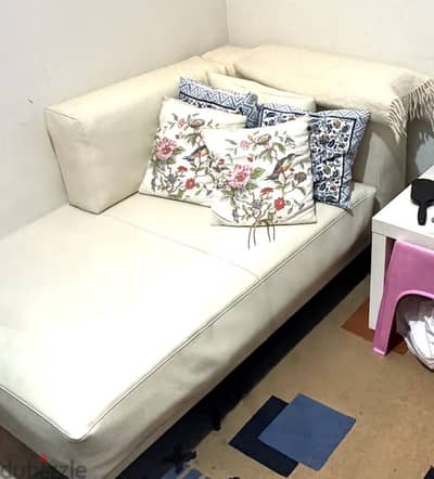 Sofa with cushions and throw