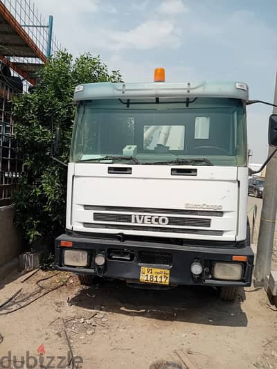 IVECO EuroCargo cargo truck with hydraulic crane.