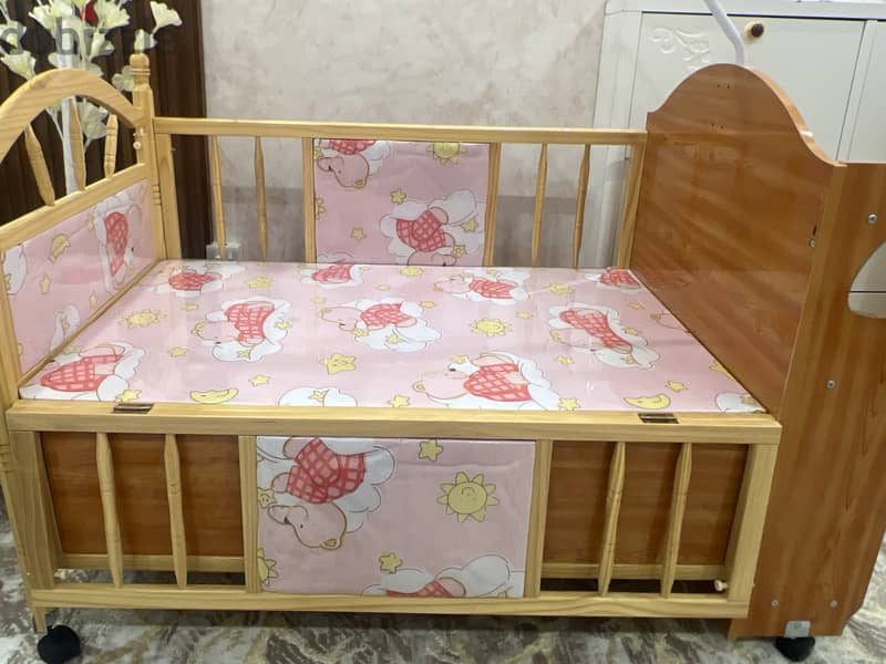 Baby crib, wooden design, one side open,comfortable, up till 3 years. 3