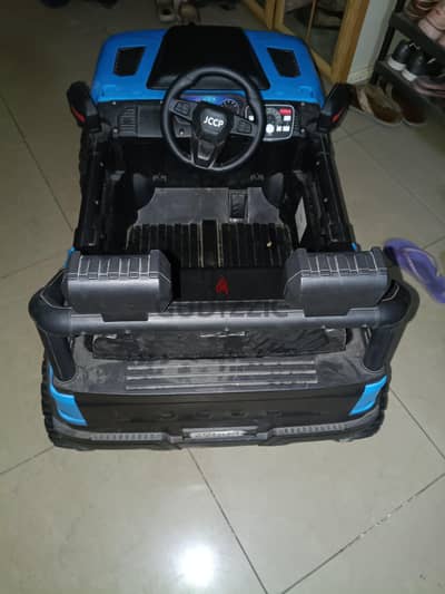 battery car for sale with battery charger.