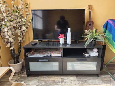 TV and TV stand for urgent sale.