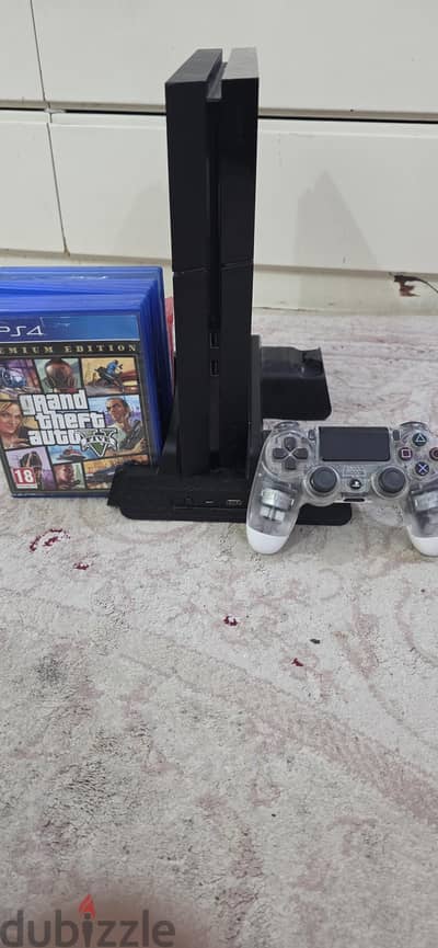 PS4 with controller and games